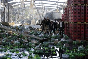 Officials inspect damage at a Coca-Cola beverages factory after Saudi-led air strikes destroyed it in Yemen's capital Sanaa December 30, 2015. REUTERS/Khaled Abdullah