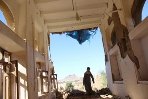 A boy walks inside a house destroyed by a recent Saudi-led air strike in the northwestern city of Saada, Yemen January 4, 2017. REUTERS/Naif Rahma